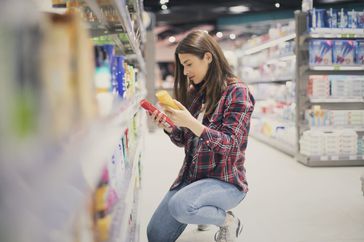 woman choosing sunscreen